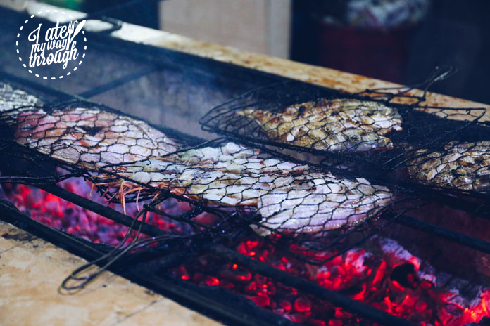 Fish and prawns grilled over coal