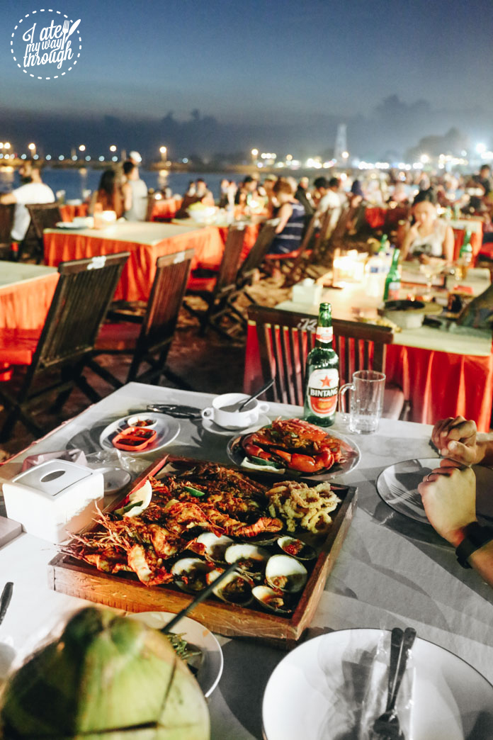 BBQ seafood platter on the beach at night