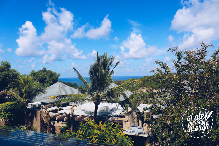 View of some villas and the ocean, from the lobby