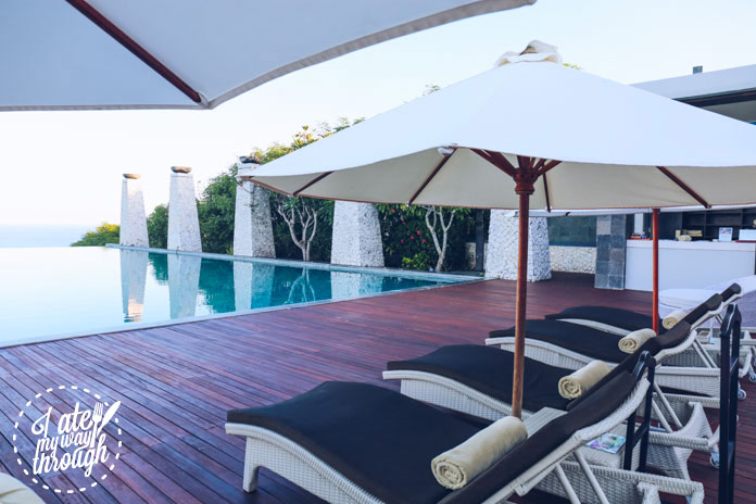 Lounges at the infinity pool where you can order from the Pool Bar