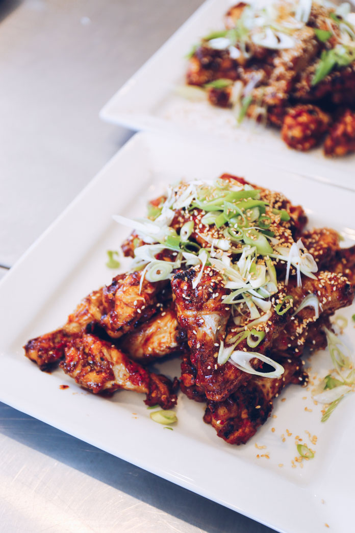 The finished dish! BBQ chicken wings tossed with smokey garlic sauce