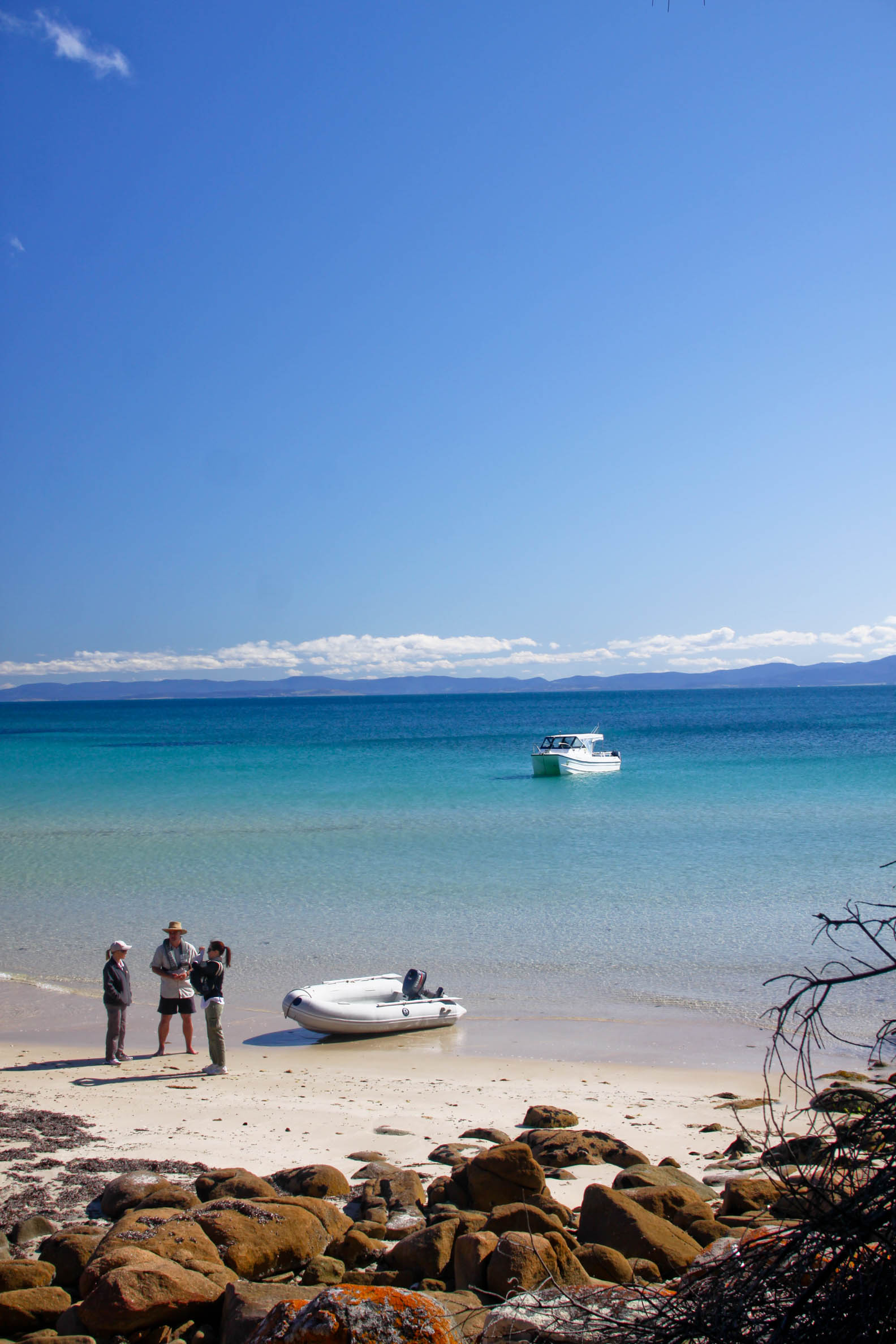 Wineglass to Wine Glass experience - Freycinet National Park, East Coast Tasmania - boat in turquoise waters